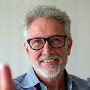 Portrait of David, 62, giving a thumbs up.